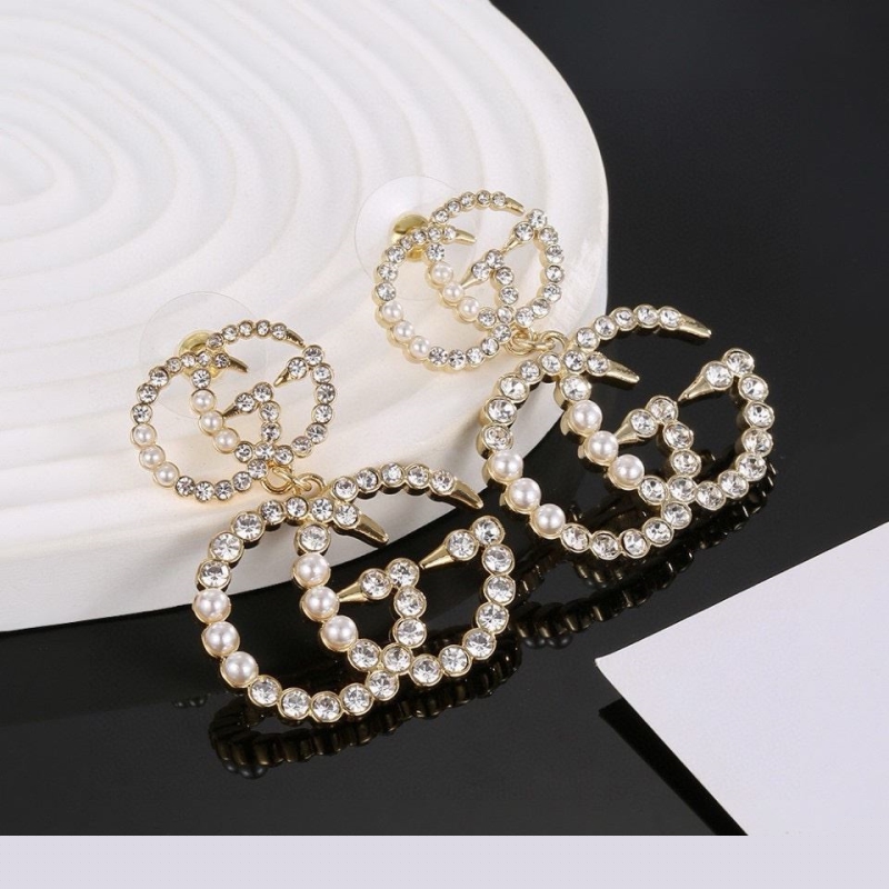 G*u*i earrings